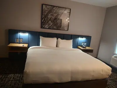 Cama o camas de una habitación en voco Saltillo Suites by IHG