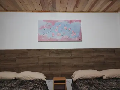 Cama o camas de una habitación en Cabaña La Camelia