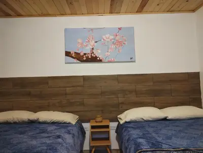 Cama o camas de una habitación en Cabaña La Camelia