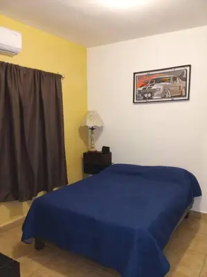 Cama o camas de una habitación en Casa completa en privada y con cochera