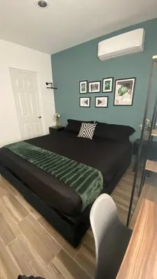 Cama o camas de una habitación en Casa Mazatlán, alberca, baño y clima en cada habitacion