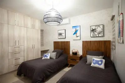 Cama o camas de una habitación en Casa Caracol. Cerca de la playa en residencial privado!