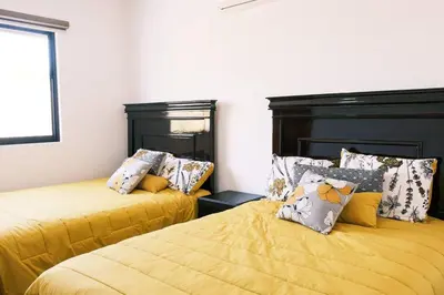 Cama o camas de una habitación en Casa con amplia terraza y vista a la alberca!