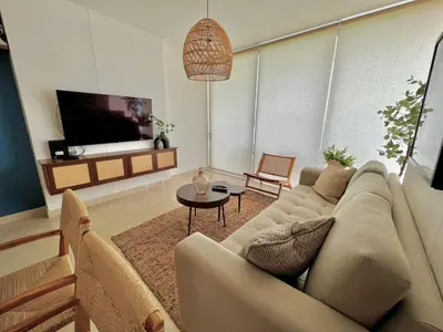 Una televisión o centro de entretenimiento en Camino al Mar 1506 Vista al Mar