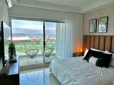 Cama o camas de una habitación en The One D16 Sobre el Malecón Vista al Estadio de Baseball