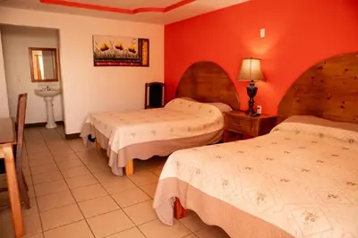 Cama o camas de una habitación en Hotel Doña Crucita