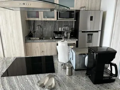 Una cocina o zona de cocina en Luxury condo en Malecón, Alberca Infinity & Jacuzzi