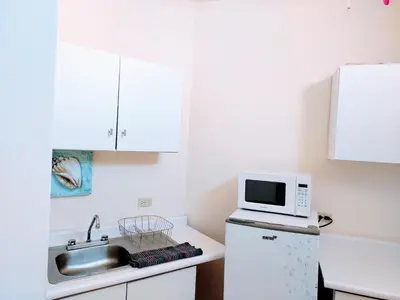 Una cocina o zona de cocina en Departamento 23 centrico , confortable , cerca de galerias mall , vado del rio , Pepsi , consulado, CAS