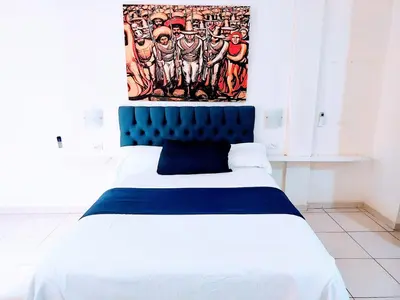 Cama o camas de una habitación en Apartamento 12 con dos camas , a 200 mts del vado del rio , cerca del centro de gobierno , internet de alta velocidad