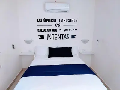 Cama o camas de una habitación en Apartamento 24 cerca de galerias mall, consulado, CAS , 2 CAMAS ,cocineta