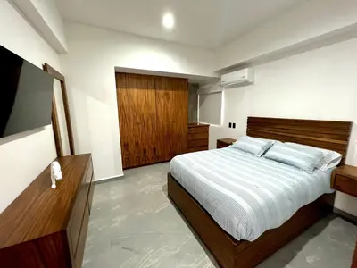 Cama o camas de una habitación en Catania Malecón 1101 Vista Panorámica al Mar