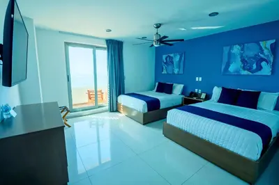 Cama o camas de una habitación en Hotel Tramonto Mazatlan