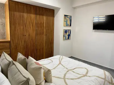 Una televisión o centro de entretenimiento en Departamento catania con vista al mar
