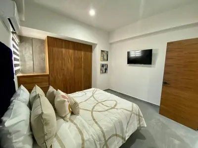 Cama o camas de una habitación en Departamento catania con vista al mar