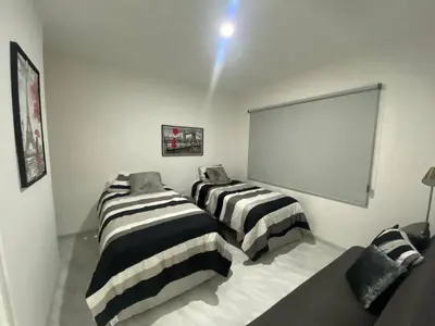Cama o camas de una habitación en Lovely 2 bedroom oceanfront condo in Mazatlan