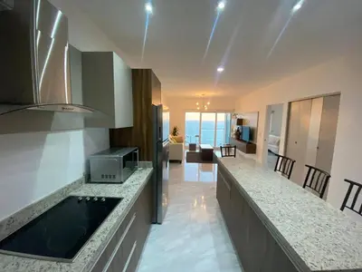 Una cocina o zona de cocina en Lovely 2 bedroom oceanfront condo in Mazatlan
