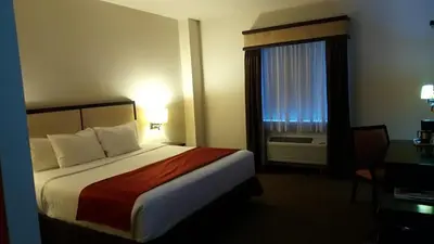 Cama o camas de una habitación en Hotel La Mina Parral