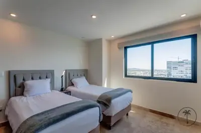 Cama o camas de una habitación en Dpto 2 hab Vista al Mar & Amenidades