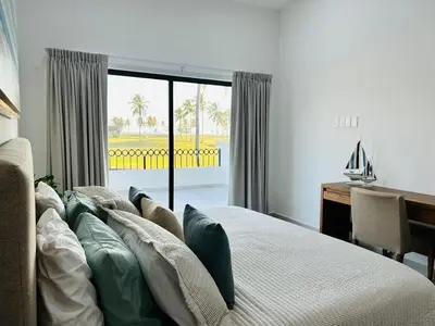 Cama o camas de una habitación en casa con alberca en campo de golf by G P S rentas
