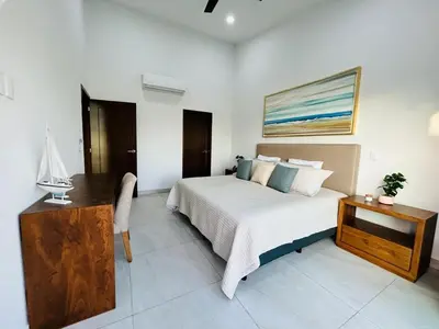 Cama o camas de una habitación en casa con alberca en campo de golf by G P S rentas