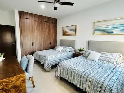 Cama o camas de una habitación en casa con alberca en campo de golf by G P S rentas