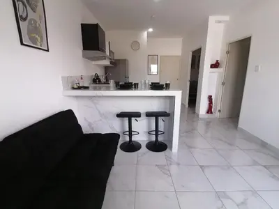 Una cocina o zona de cocina en excelente departamento vacacional