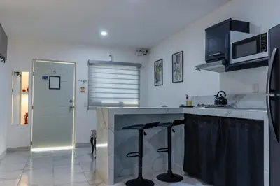 Una cocina o zona de cocina en excelente departamento vacacional