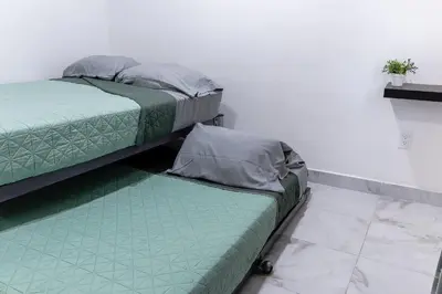Cama o camas de una habitación en excelente departamento vacacional