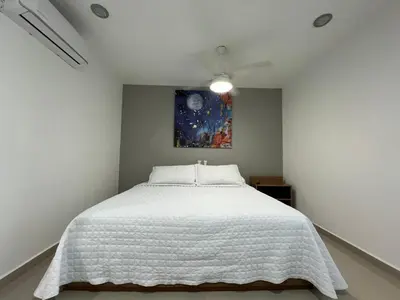 Cama o camas de una habitación en Departamento en Tramonto Resort con vista al mar